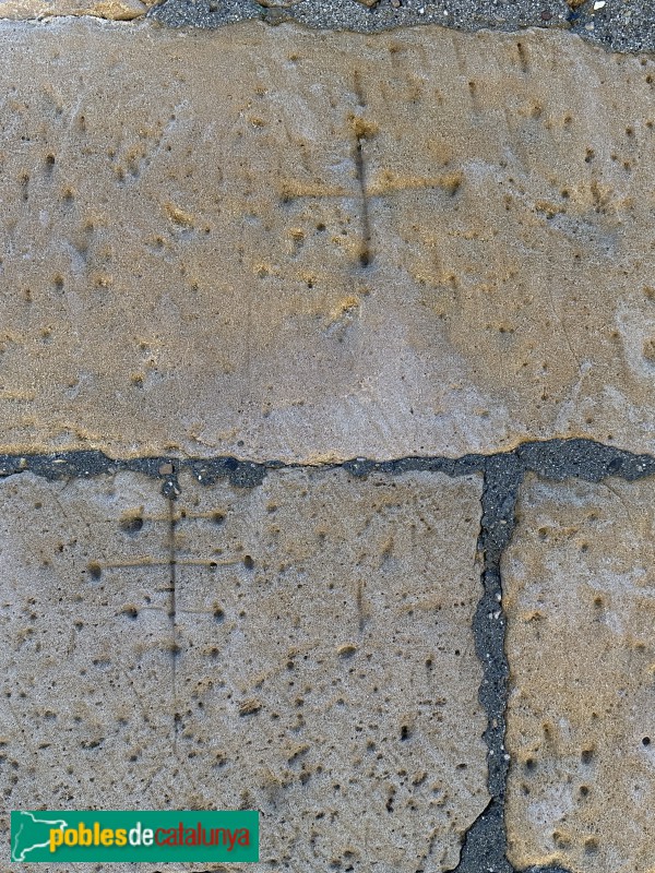 Alfés - Església de Sant Pere. Marques de picapedrer