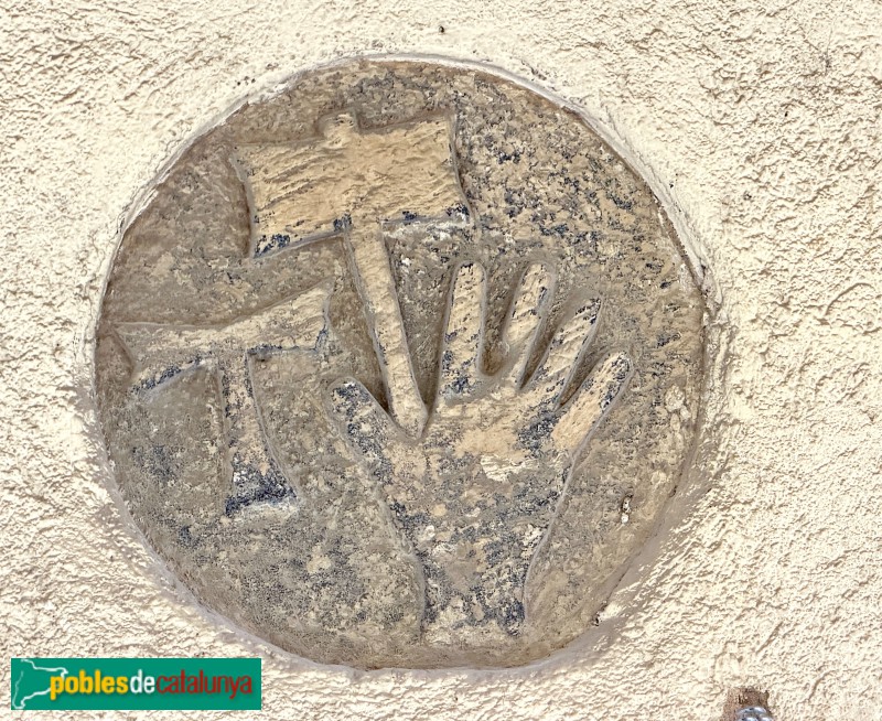 Cabacés - Antiga dovella amb la tau, una mà i un martell